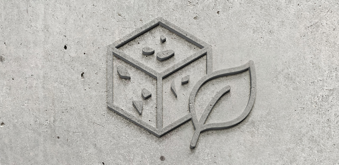 Symbolbild Betonwürfel mit Blatt, beides als Struktur auf Sichtbeton
